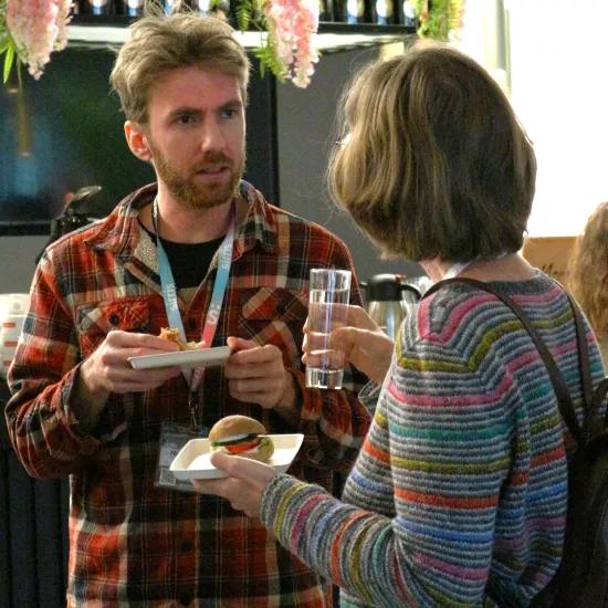 People talking at the bar at LDES event