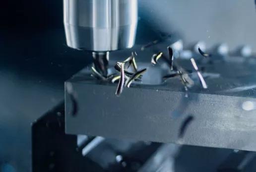 close-up of a metal component being machined